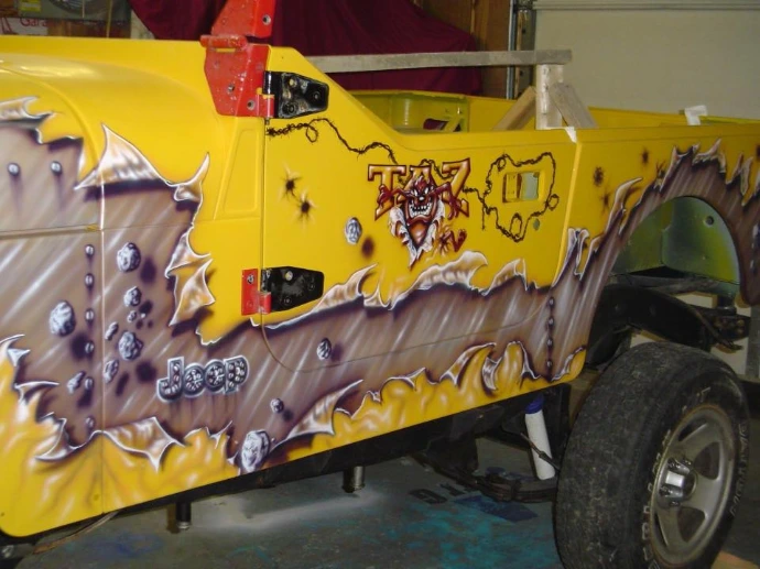 metal rip going down side of jeep with taz